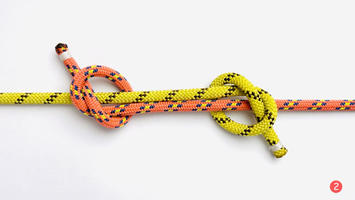 fisherman's-knot-step-2-how-to-tie-the-fisherman's-knot-knotspedia